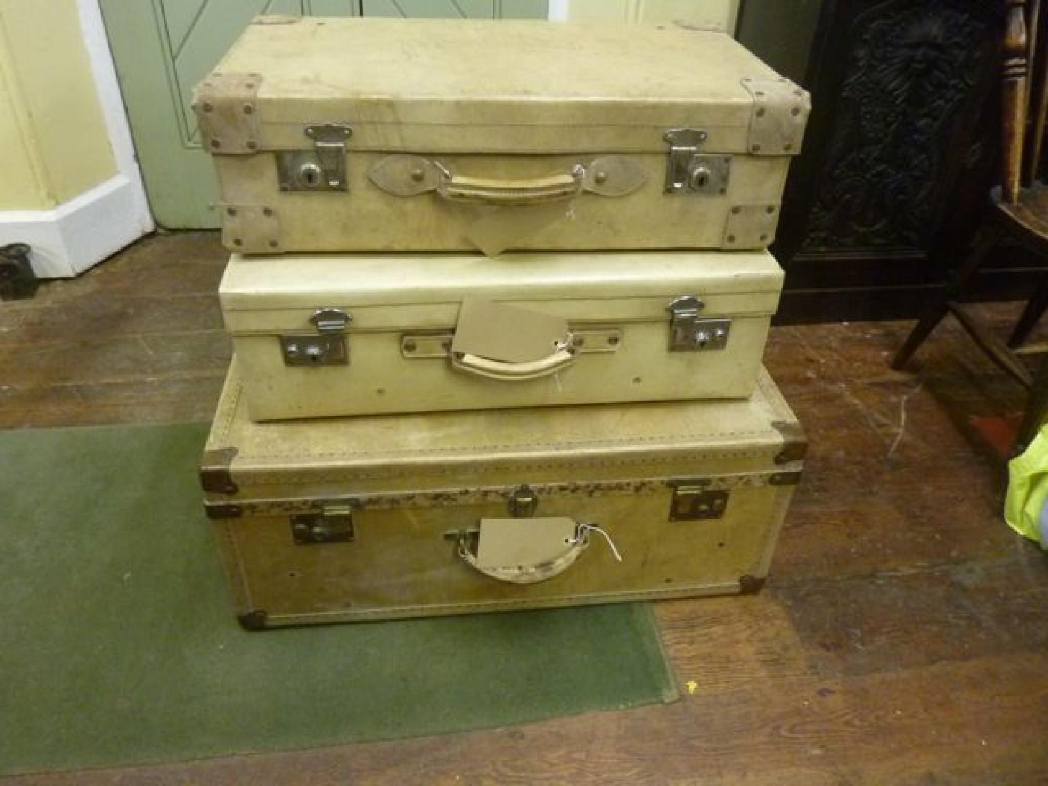 Appraisal: Two vintage vellum suitcases together with a further vellum trunk