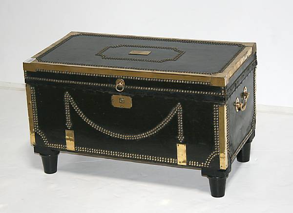 Appraisal: A Regency brass mounted leather traveling box on later feet