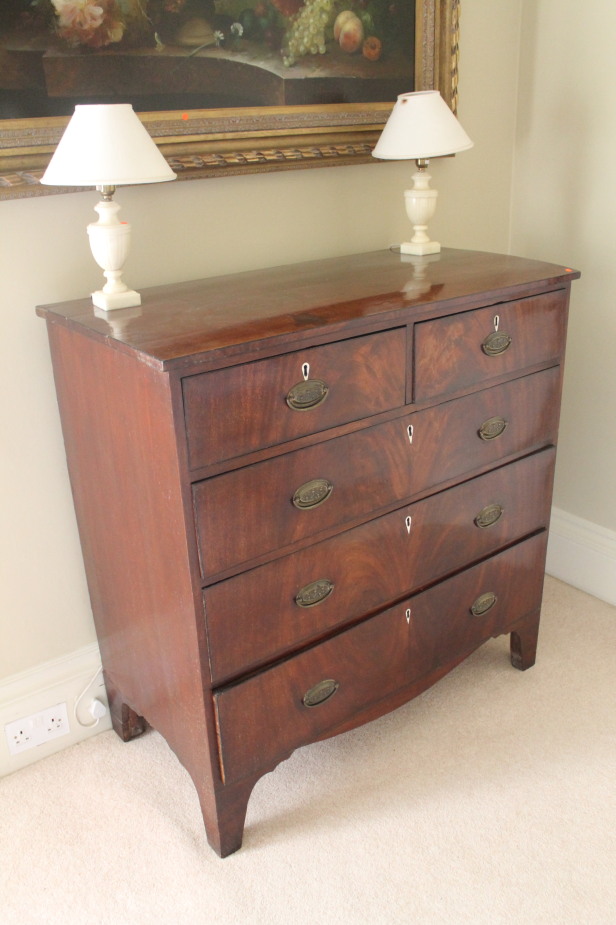 Appraisal: A Regency flamed mahogany chest of two short and three