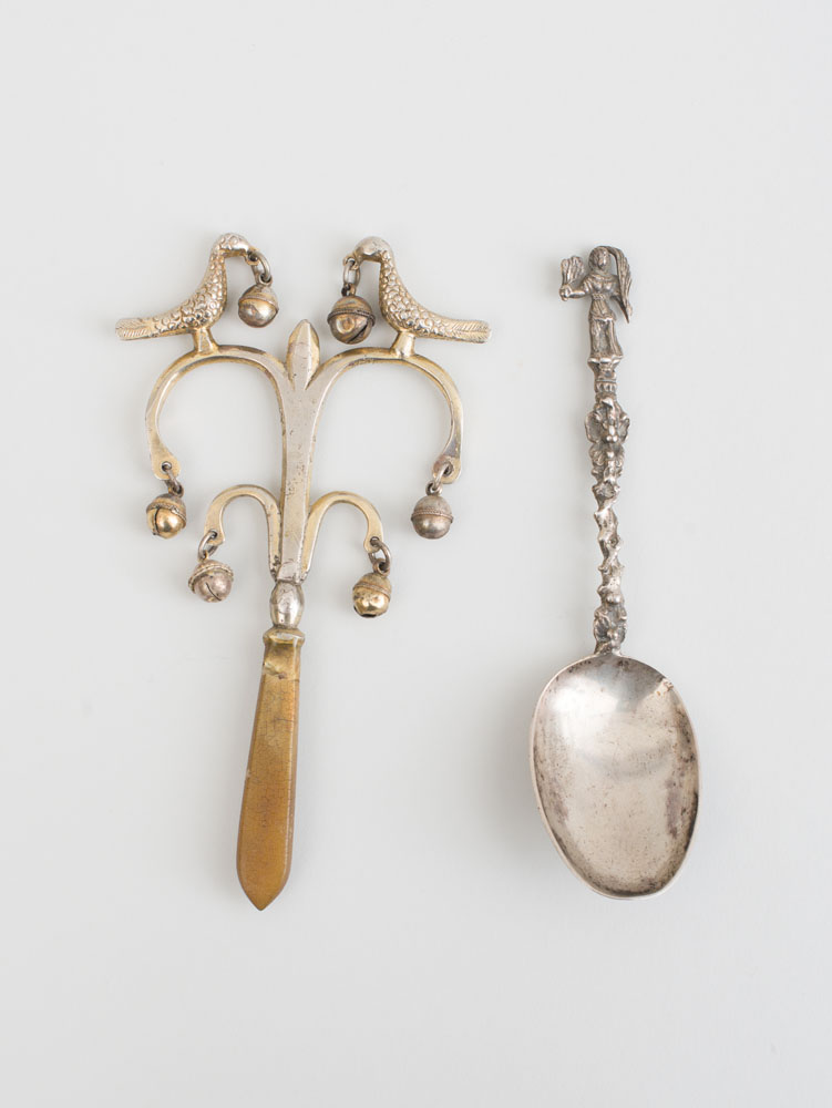 Appraisal: CONTINENTAL SILVERED METAL RATTLE AND SILVER SPOON Rattle with a