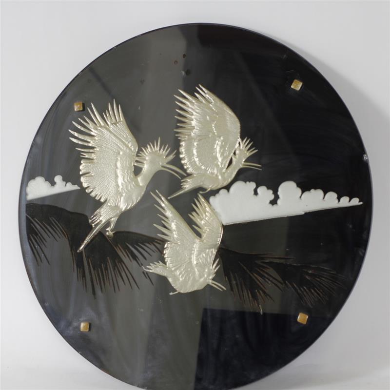 Appraisal: Art deco black mirrored glass circular panel with reverse decorated