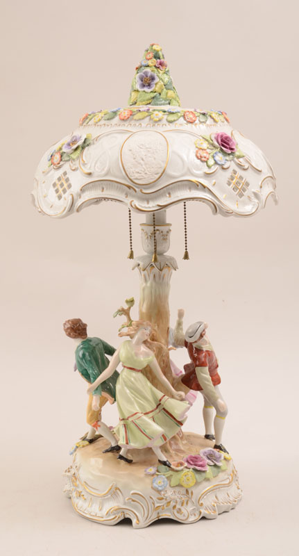 Appraisal: German Porcelain Figural Table Lamp The pierced domical shade with