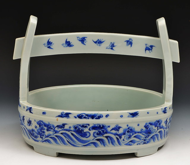 Appraisal: A Japanese Hirado porcelain basket th Centurydecorated with waves and