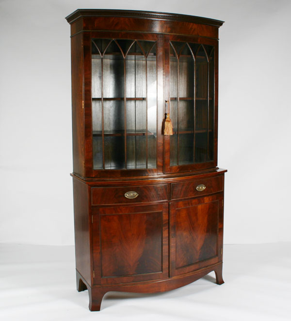 Appraisal: Mahogany two piece bow front china cabinet two glass doors