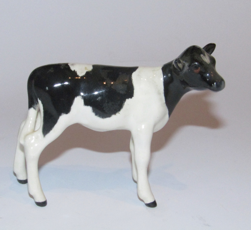 Appraisal: A thC Beswick pottery Friesian calf style one printed marks