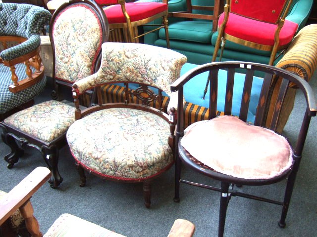 Appraisal: An inlaid Edwardian mahogany tub chair raised on reeded supports