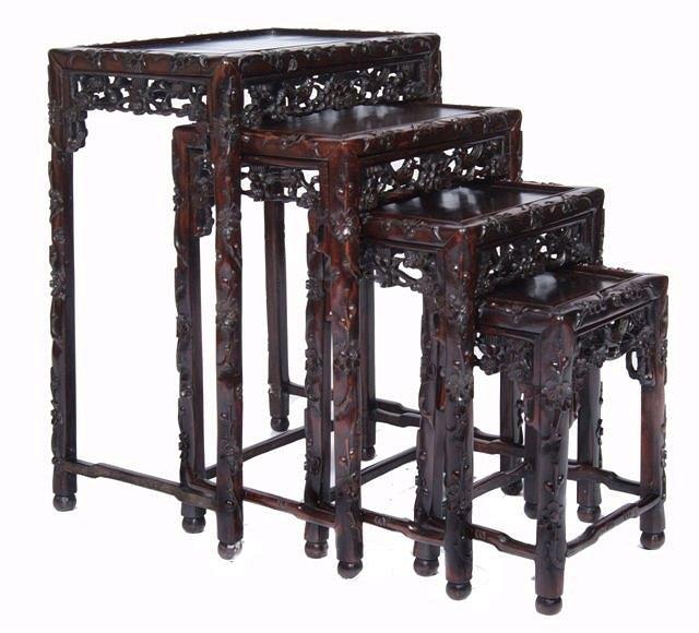 Appraisal: A QUARTETTO OF CHINESE CARVED CHERRYWOOD TEA TABLES of graduated