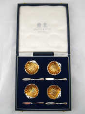 Appraisal: A boxed set of four plated silver gilt individual butter