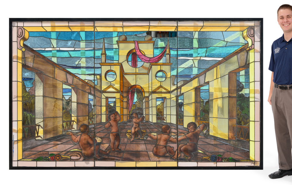 Appraisal: LARGE STAINED GLASS WINDOW WITH PUTTI Nicely executed stained glass