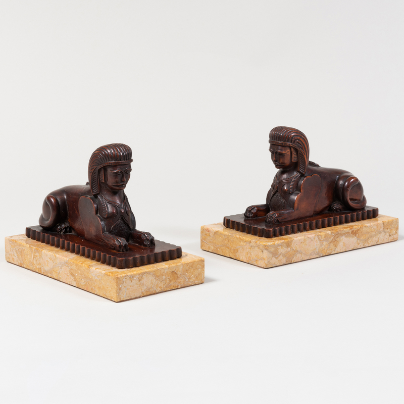 Appraisal: Pair of Carved Wood and Marble Models of Sphinx x