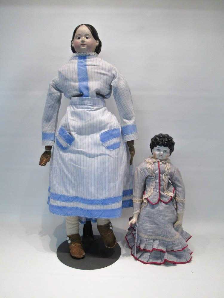 Appraisal: TWO CIVIL WAR ERA DOLLS the first with china head