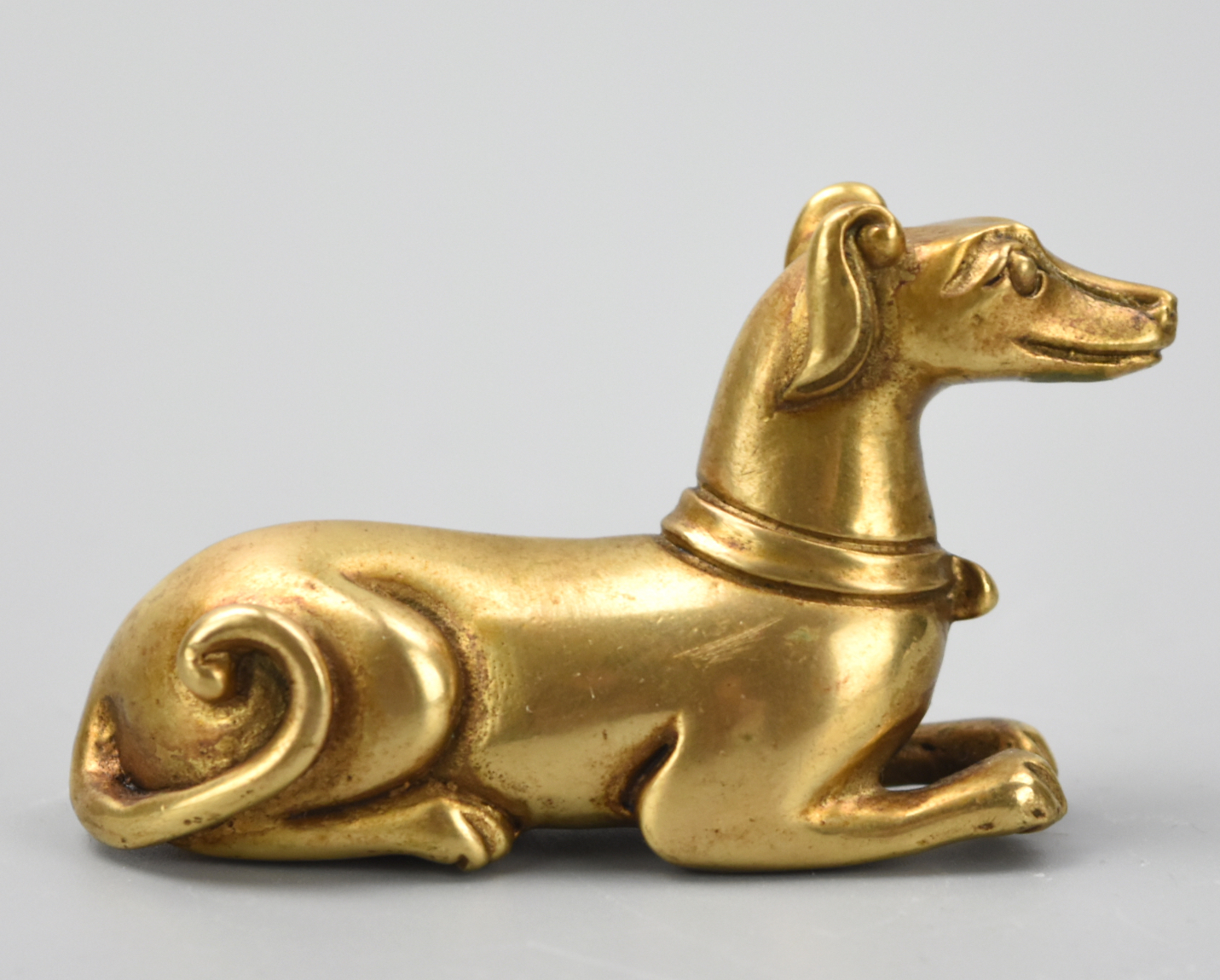 Appraisal: CHINES GILT BRONZE FIGURE OF GREYHOUND QING D A small