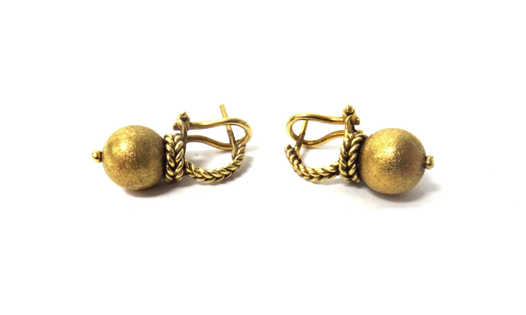 Appraisal: A pair of gold earrings each with a textured bead