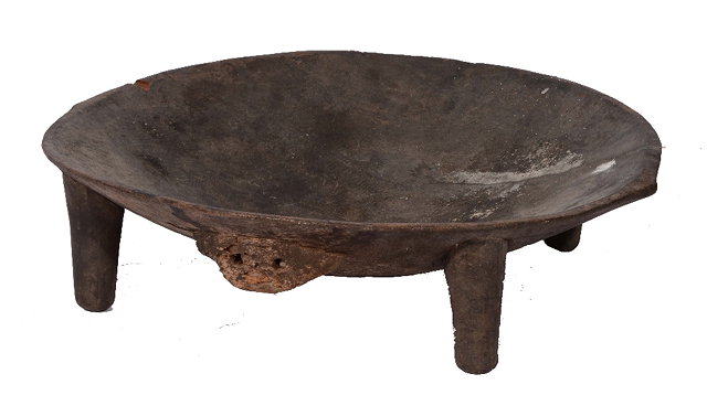 Appraisal: A Tongan circular wooden feasting bowl with carved mask decoration