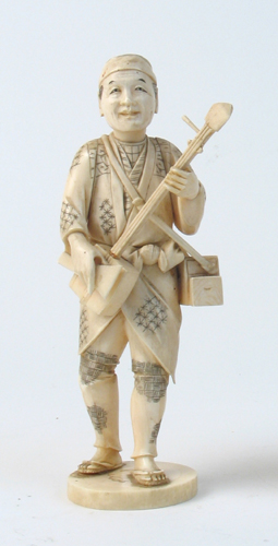 Appraisal: A JAPANESE IVORY CARVING depicting a male musician standing and