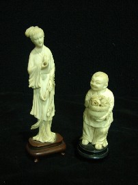 Appraisal: Two Chinese ivory figures one a boy holding a bsket