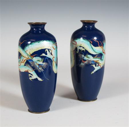 Appraisal: A pair of Japanese cloisonn enamel vases with flared neck