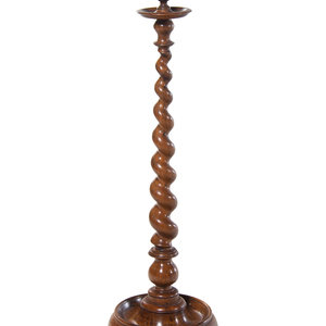 Appraisal: An Oversized English Barley Twist Carved Candlestick th Century Height