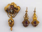 Appraisal: An antique carat gold pendant brooch and earrings set with