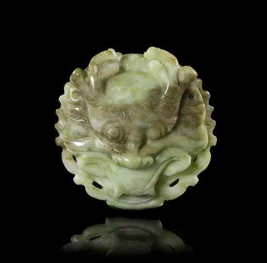 Appraisal: A Chinese Jade Belt Buckle of mottled grey and celadon