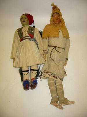 Appraisal: A male costume doll with painted bisque head black mohair