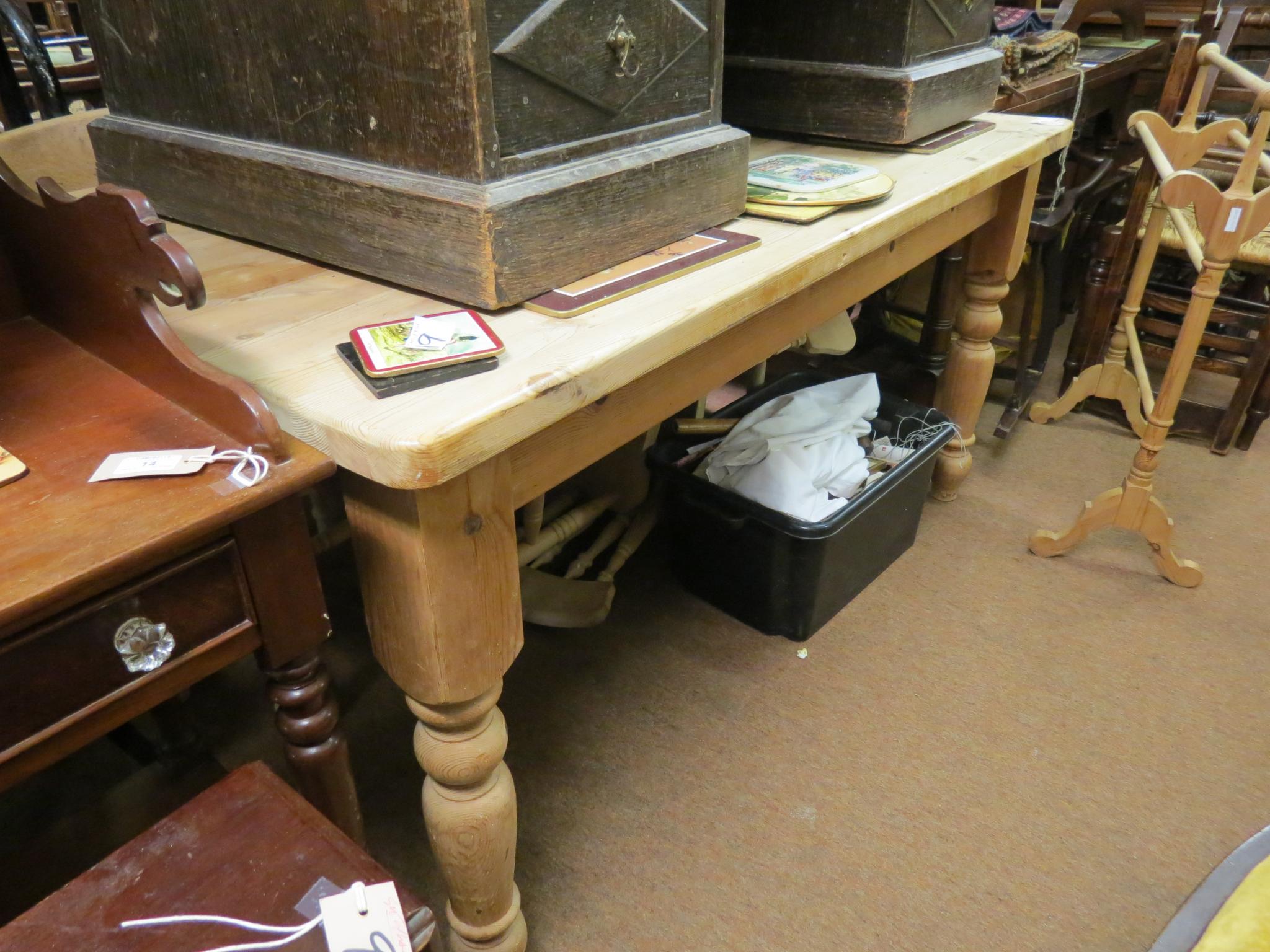 Appraisal: A solid pine farmhouse table rectangular plank-top on turned legs