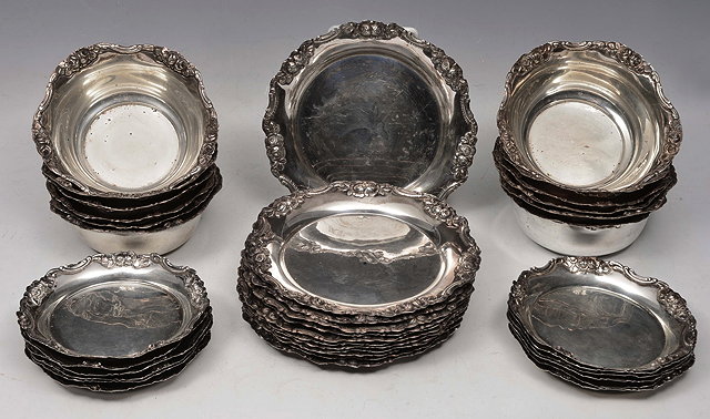 Appraisal: A GREEK WHITE METAL DESSERT SERVICE comprising twelve plates twelve