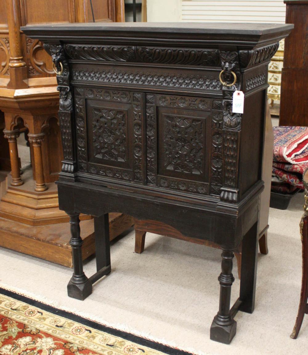 Appraisal: CARVED AND EBONIZED CABINET ON CUSTOM STAND Continental cabinet late