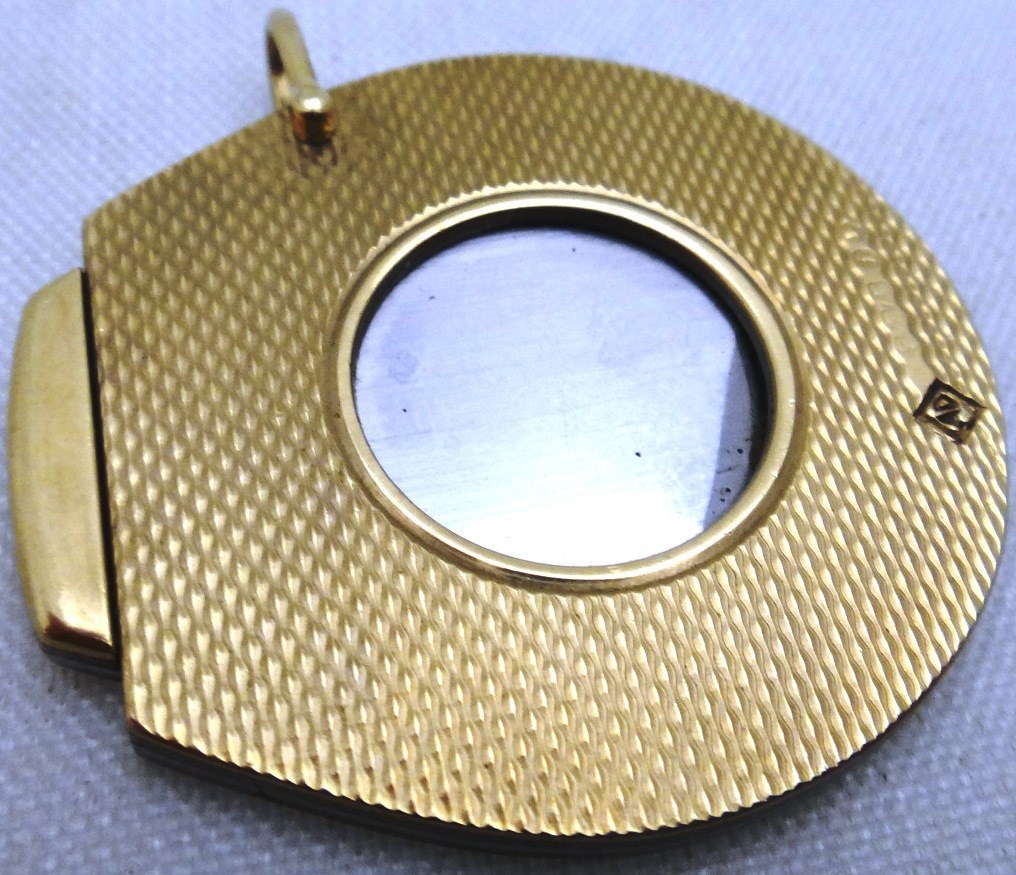 Appraisal: A ct gold mounted slide action cigar cutter with engine