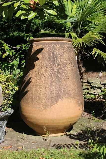 Appraisal: A LARGE PAIR OF TERRACOTTA TAPERING OVOID GARDEN POTS each