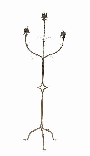 Appraisal: A French Renaissance style iron three light torch re th