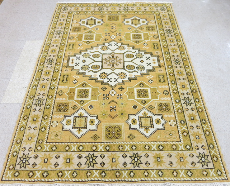 Appraisal: HAND KNOTTED ORIENTAL CARPET Indo-Kazak overall geometric motif on yellow