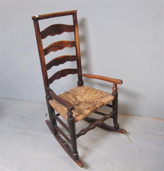 Appraisal: th century Elm ladder back rocking chair