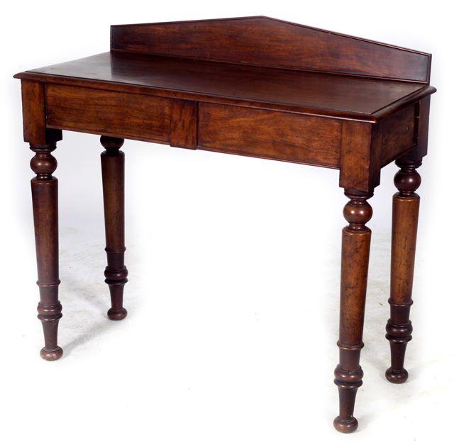 Appraisal: VICTORIAN MAHOGANY SIDE TABLE with pedimented backboard above a moulded