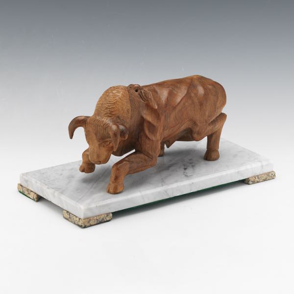 Appraisal: CARVED WOOD SCULPTURE OF CHARGING BULL ON MARBLE BASE x