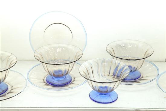 Appraisal: SIX STEUBEN SHERBERTS UNDERPLATES Smokey clear glass with blue bases