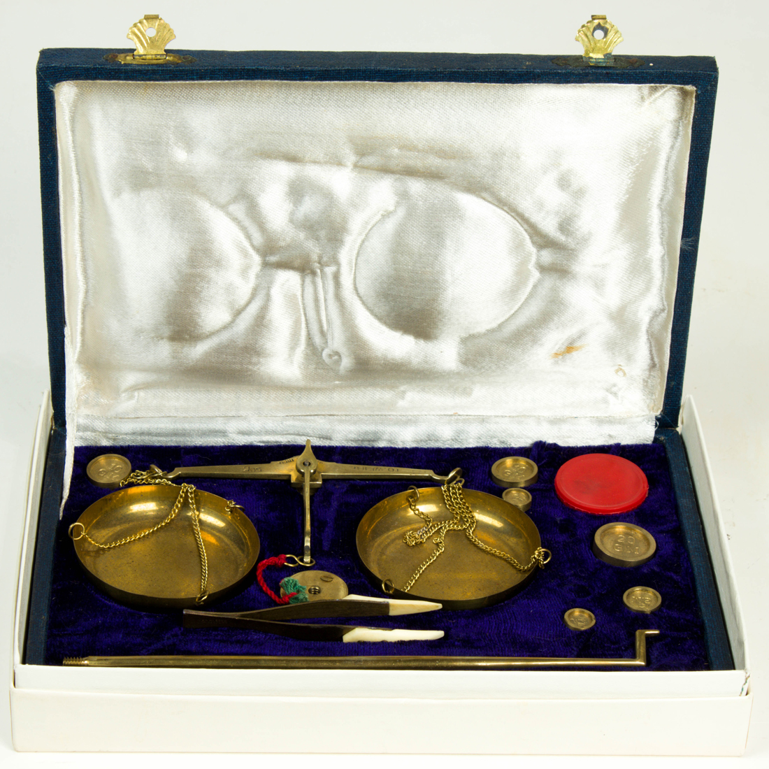 Appraisal: MINIATURE TRAVELING JEWELRY SCALE WITH WEIGHTS MEASURED IN GRAMS Miniature