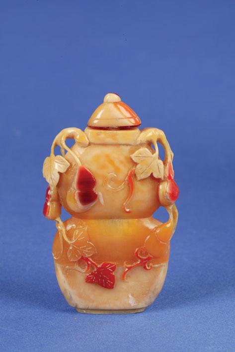 Appraisal: A CARVED HORNBILL IVORY BOTTLE of flattened double gourd form