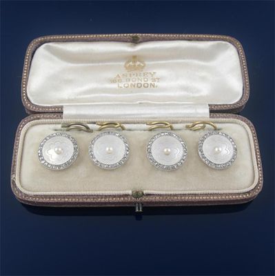 Appraisal: A cased set of four dress studs the circular shell