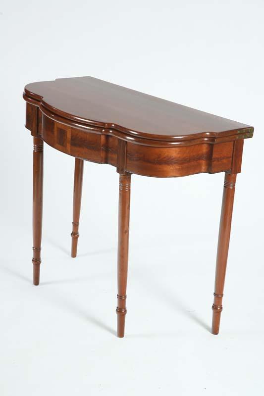 Appraisal: CARD TABLE Cherry having a serpentine banded front on ring