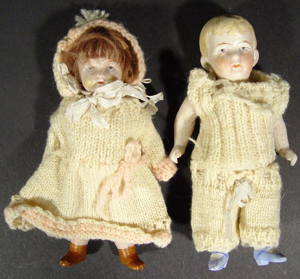 Appraisal: Pair of small bisque dolls with jointed limbs and hand