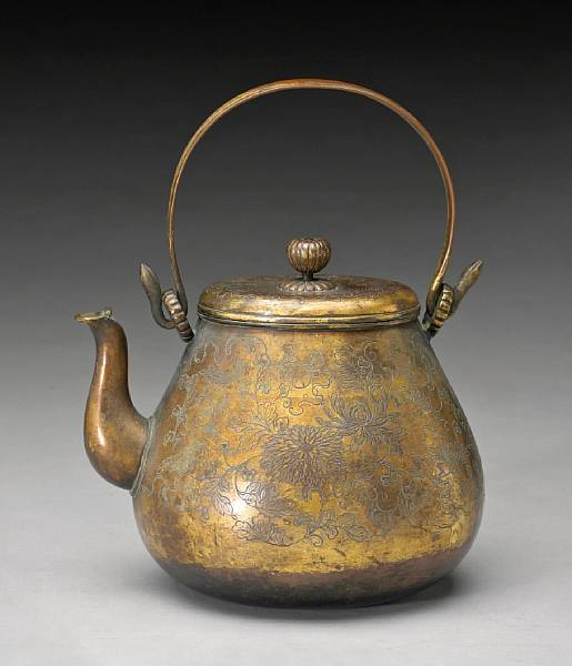 Appraisal: A gilt copper pouring vessel th Century The pear-shape body