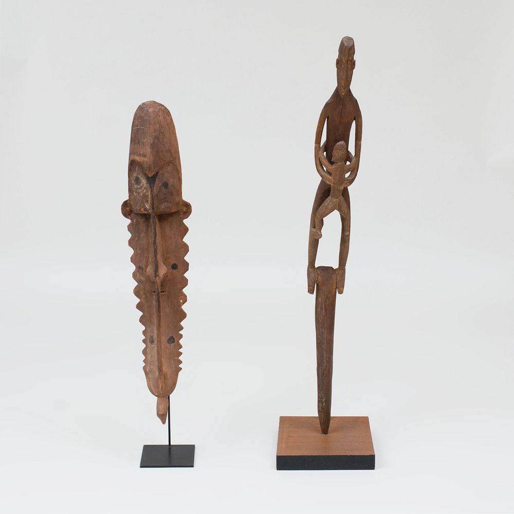 Appraisal: Two Oceanic Carved Wood Figural Items on Stands The figurative