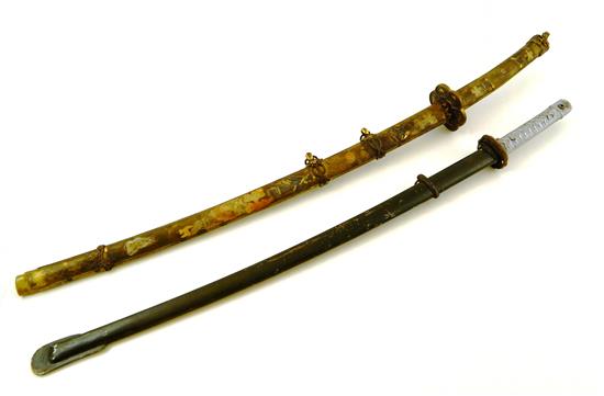 Appraisal: Two contemporary Chinese swords first in elaborately decorated scabbard with