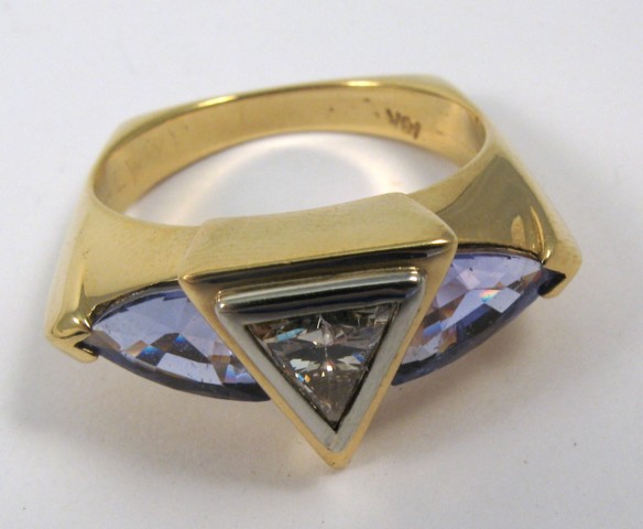 Appraisal: DIAMOND TANZANITE AND EIGHTEEN KARAT GOLD RING centering a trilliant