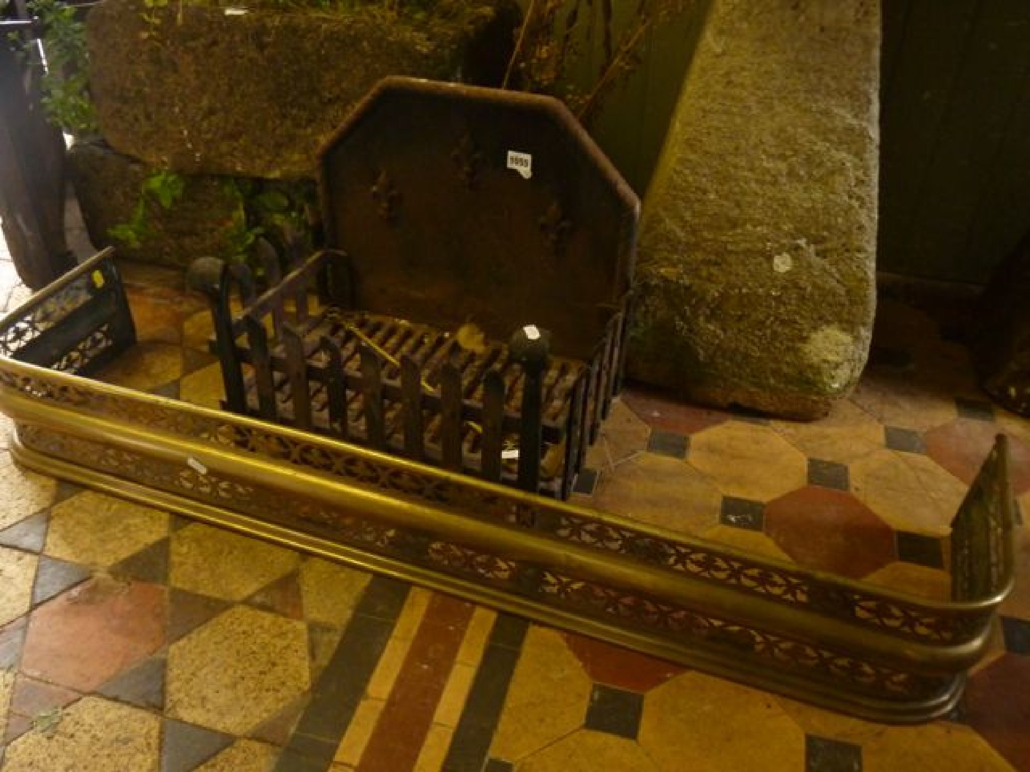 Appraisal: A cast iron fire basket with trellis frieze and combined