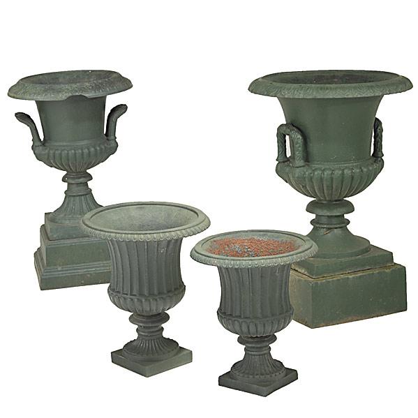 Appraisal: GARDEN DECORATIONFour cast iron urns th c Largest x dia