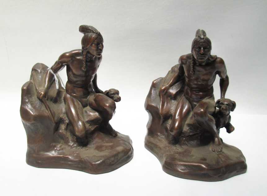 Appraisal: JENNINGS BROTHERS BRONZE-CLAD FIGURAL BOOKENDS each depicting a crouching Indian