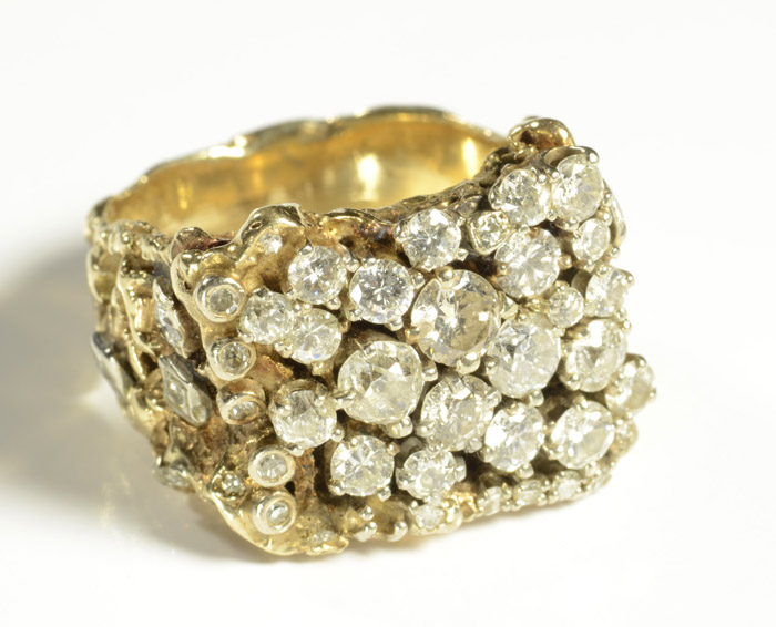 Appraisal: MAN'S DIAMOND CLUSTER AND TEN YELLOW GOLD RING set with