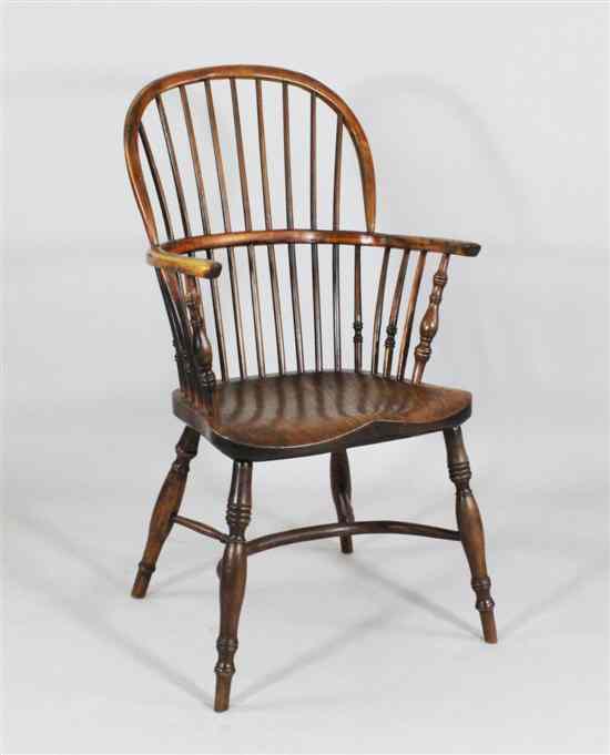 Appraisal: An early th century yew and elm Windsor chair with